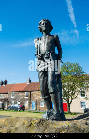 Great Ayton, North  North Yorkshire, England, UK. 3rd May, 2018. Weather: The statue of a young James Cook bathed in glorious sunshine on the village green in his boyhood village, Great Ayton.  2018 marks the 250th anniversary of Captain Cook`s first Pacific voyage, with events planned nationwide to commemorate the event. Credit: ALAN DAWSON/Alamy Live News Stock Photo
